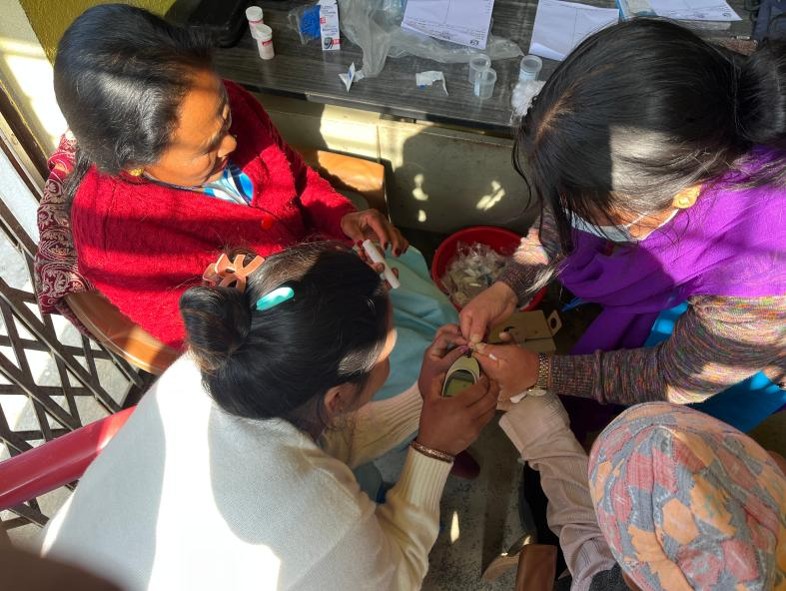 Health worker counseling a community member